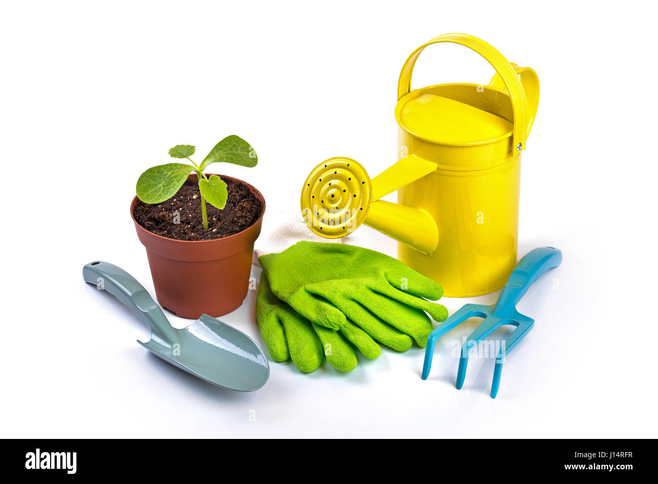 gardening equipment and potted plant isolated on white background Stock Photo