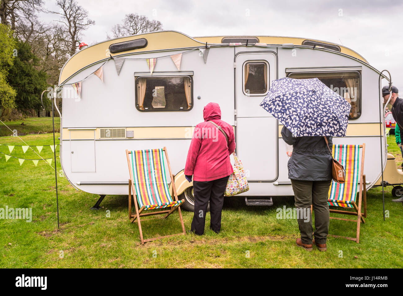 Typical old caravan or caravans in a park, Britain, in spring holiday wet weather Stock Photo