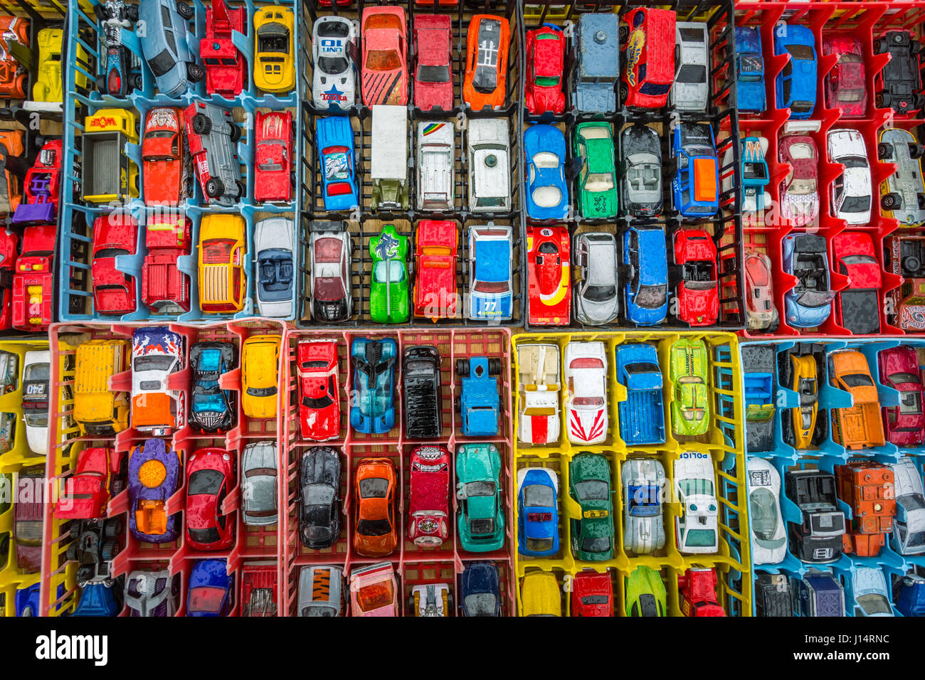 Boxes of toy cars autos on sales in a market Stock Photo