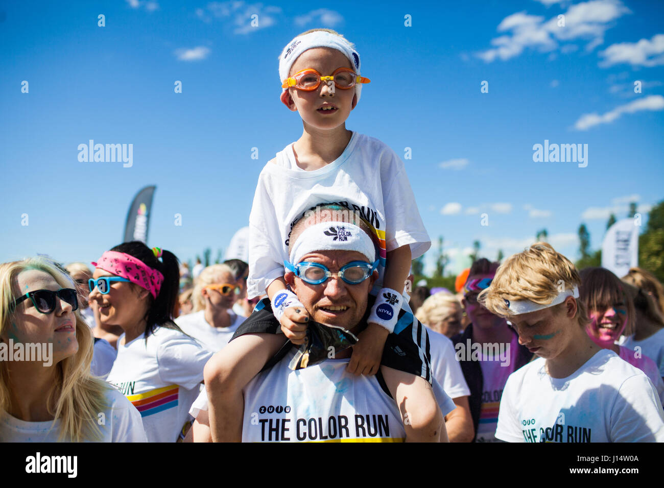 The Color Run is for people in all ages. Here father and sun are well prepared with swim classes and ready to run the happiest five kilometres in thei Stock Photo