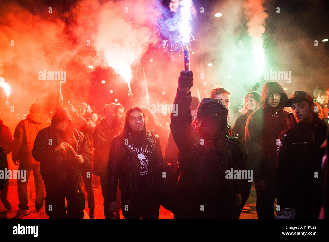 Left wing protesters light up flares during the anti-capitalistic march ...