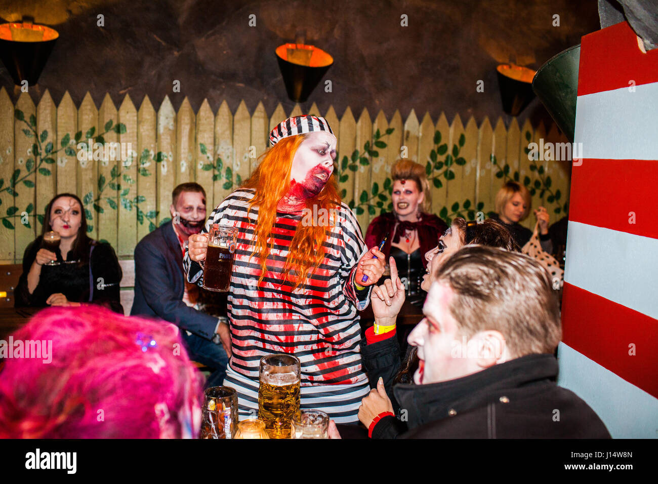 An escaped prisoner has turned into a bloody and beer drinker zombie. Denmark, Copenhagen 19/10 2013. Stock Photo