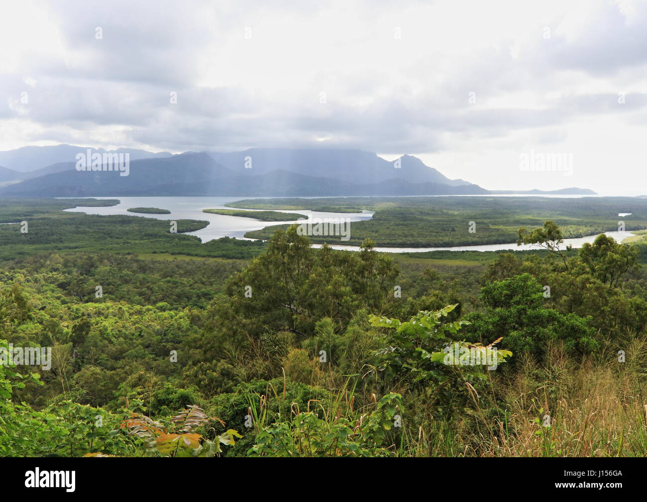 View from Panjoo Lookout off the Bruce Highway, in Girrigun National Park, on the Cardwell Ranges, overlooking Seymour River and Hinchinbrook Channel Stock Photo