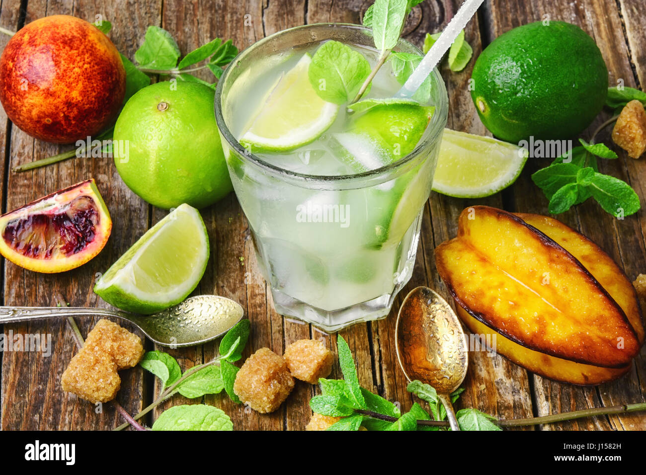 summer refreshing cocktail of fresh lime juice,orange and averrhoa Stock Photo