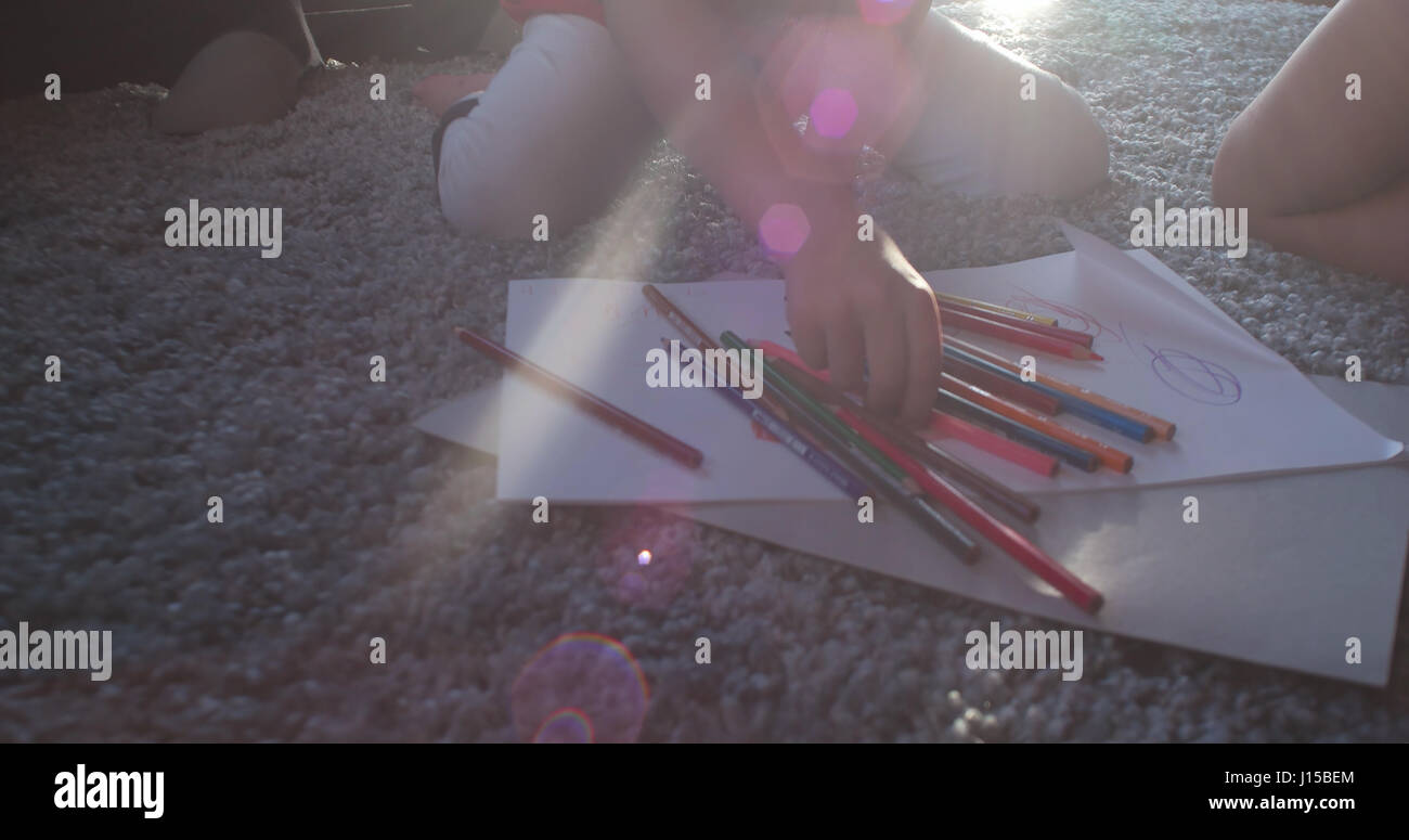 living room with coloring set for kids on floor Stock Photo - Alamy