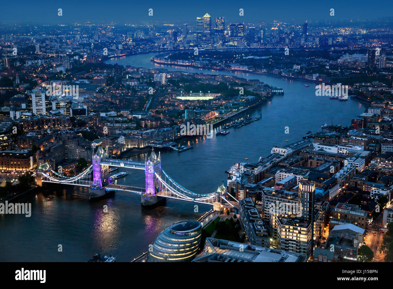 Aerial view over London at night with Tower Bridge. Stock Photo