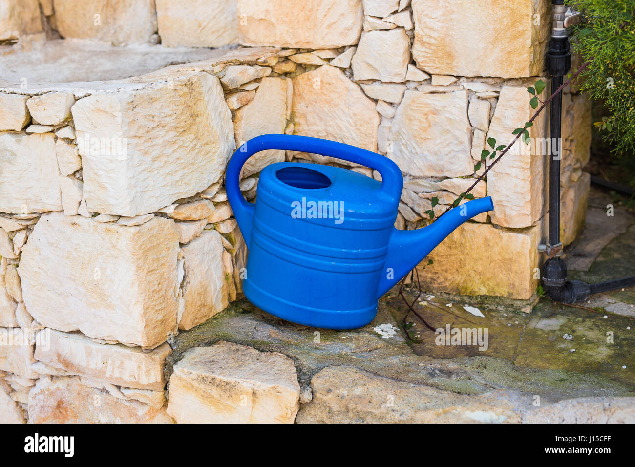 Outdoor shower and cold water bucket in a spa Stock Photo - Alamy