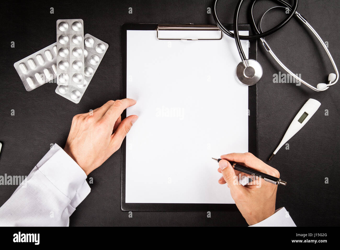 Doctor's working table Stock Photo - Alamy