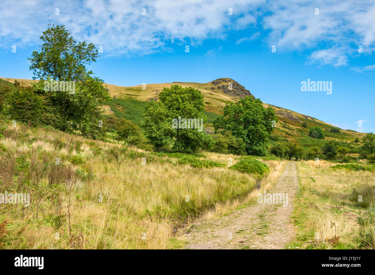 Heading up the Cwms valley with Caer Caradoc Hill ahead, near Church Stretton, Shropshire, England, UK. Stock Photo