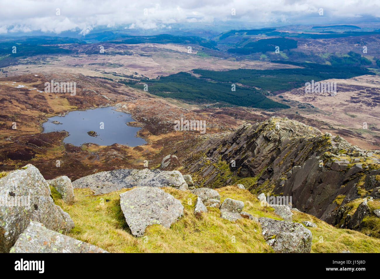 High view above Llyn Y Foel lake from Daear Ddu east ridge on Carnedd Moel Siabod mountain in mountains of Snowdonia National Park. North Wales UK Stock Photo