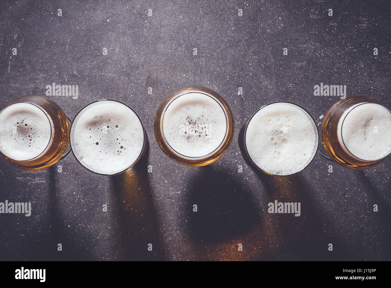 Beer glasses on dark table Stock Photo