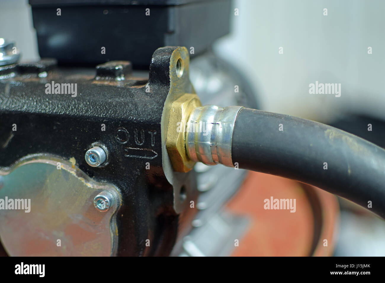 Close up of water pump and hose Stock Photo Alamy