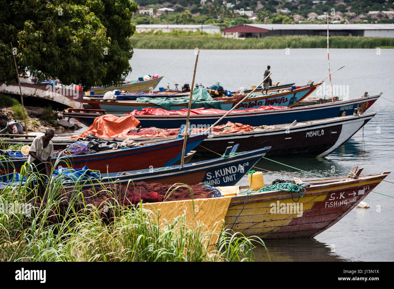 Fishing boats lining the shoreline of Lake Tanganyika, Zambia. The industry has been negatively affected by climate change Stock Photo