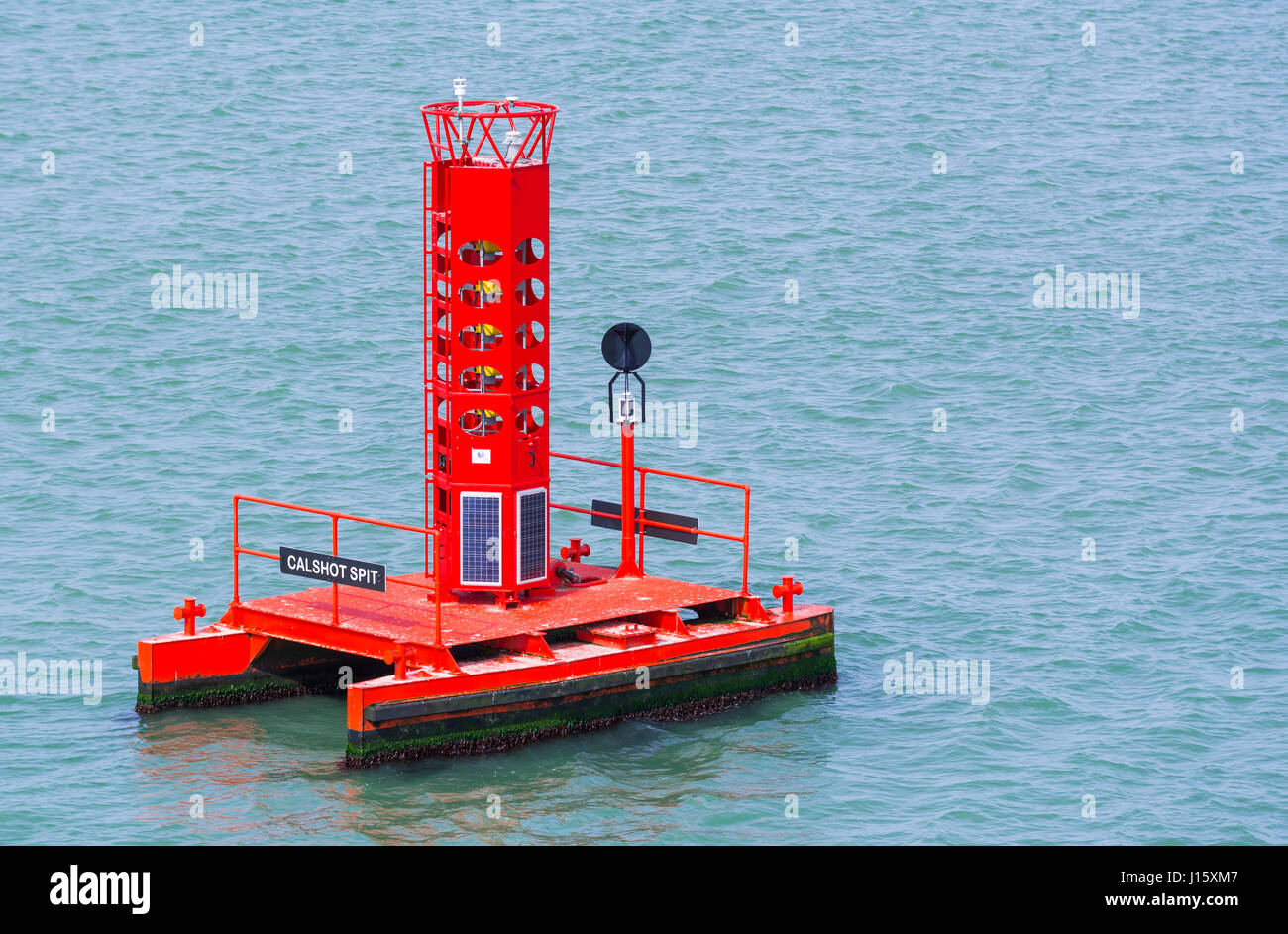 Solar powered red sea marker and channel marker. Stock Photo