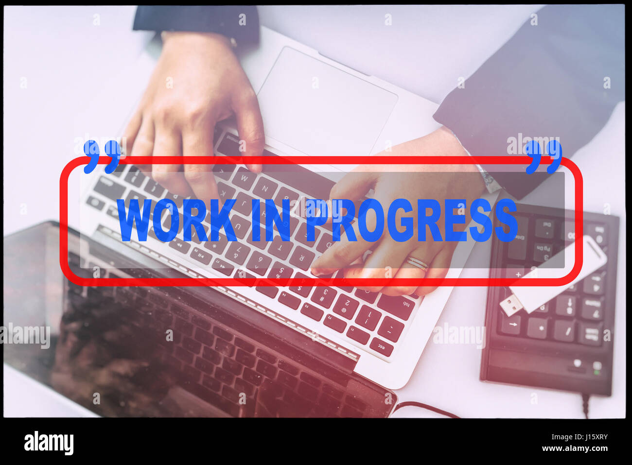 Hand and text "WORK IN PROGRESS" with vintage background. Technology ...