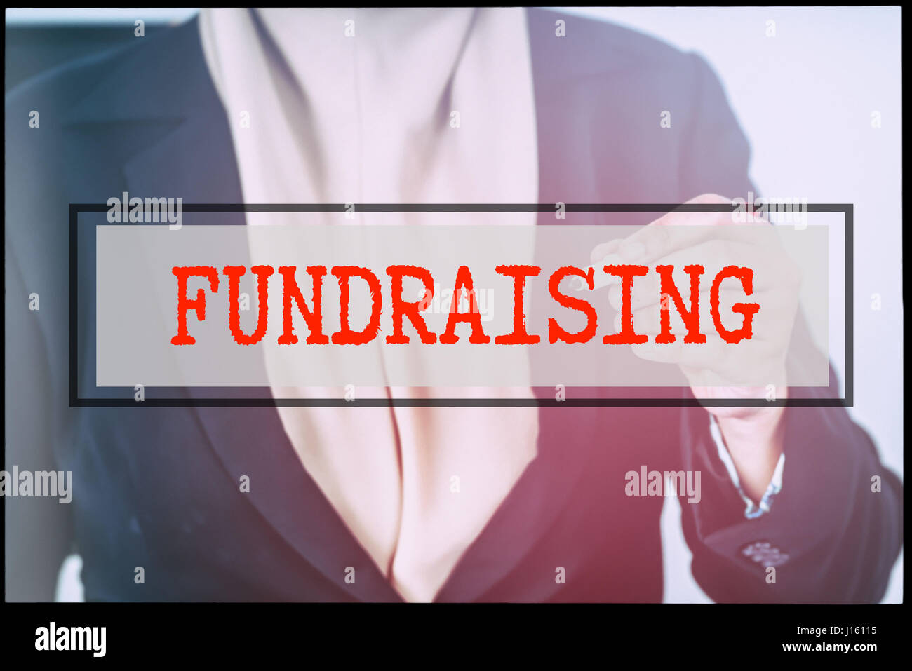 Hand and text FUNDRAISING with vintage backgound. Technology concept ...