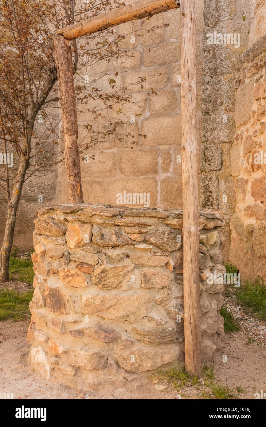 A toned photo of an old stone water well in Spain Stock Photo