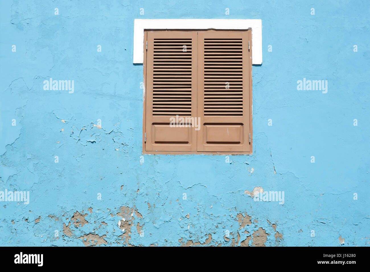 Shuttered Window on a colonial house Stock Photo