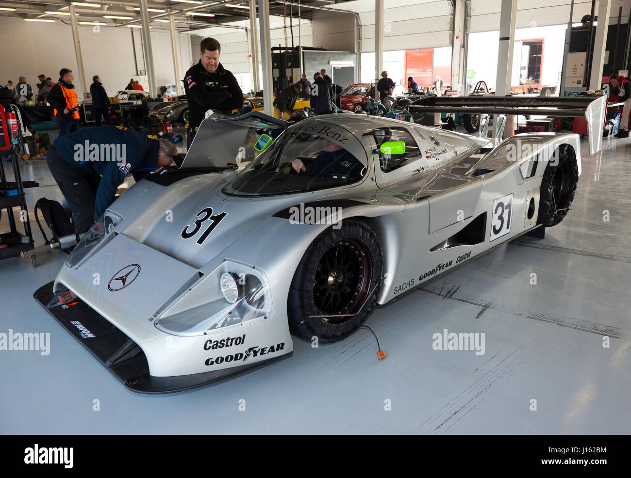 View of  a Sauber Mercedes C11 once driven by Mauro Baldi and  Michael Schumacher. In the International Pits at the Silverstone Classic Media Day 2017 Stock Photo