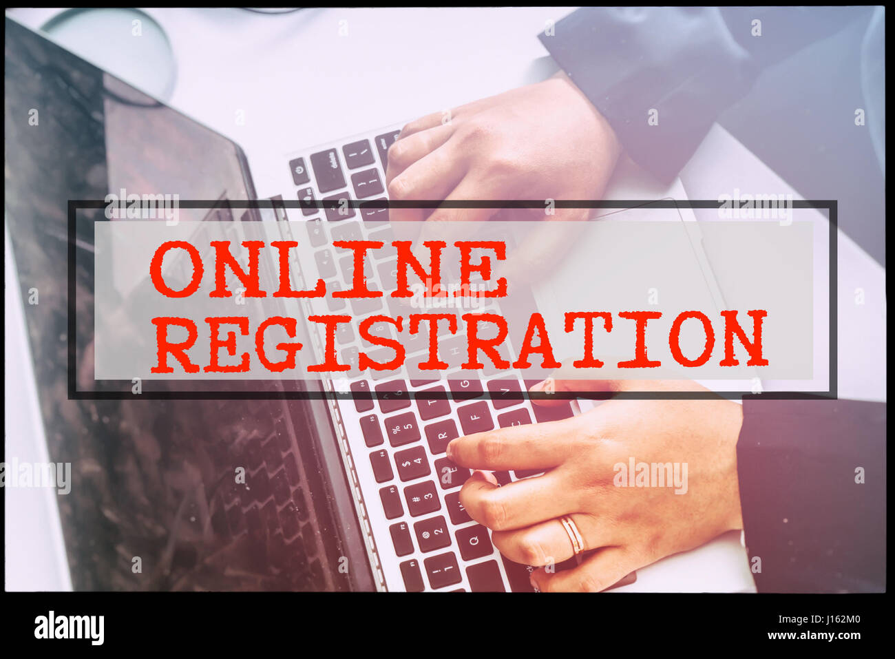 Hand and text ONLINE REGISTRATION with vintage background. Technology ...
