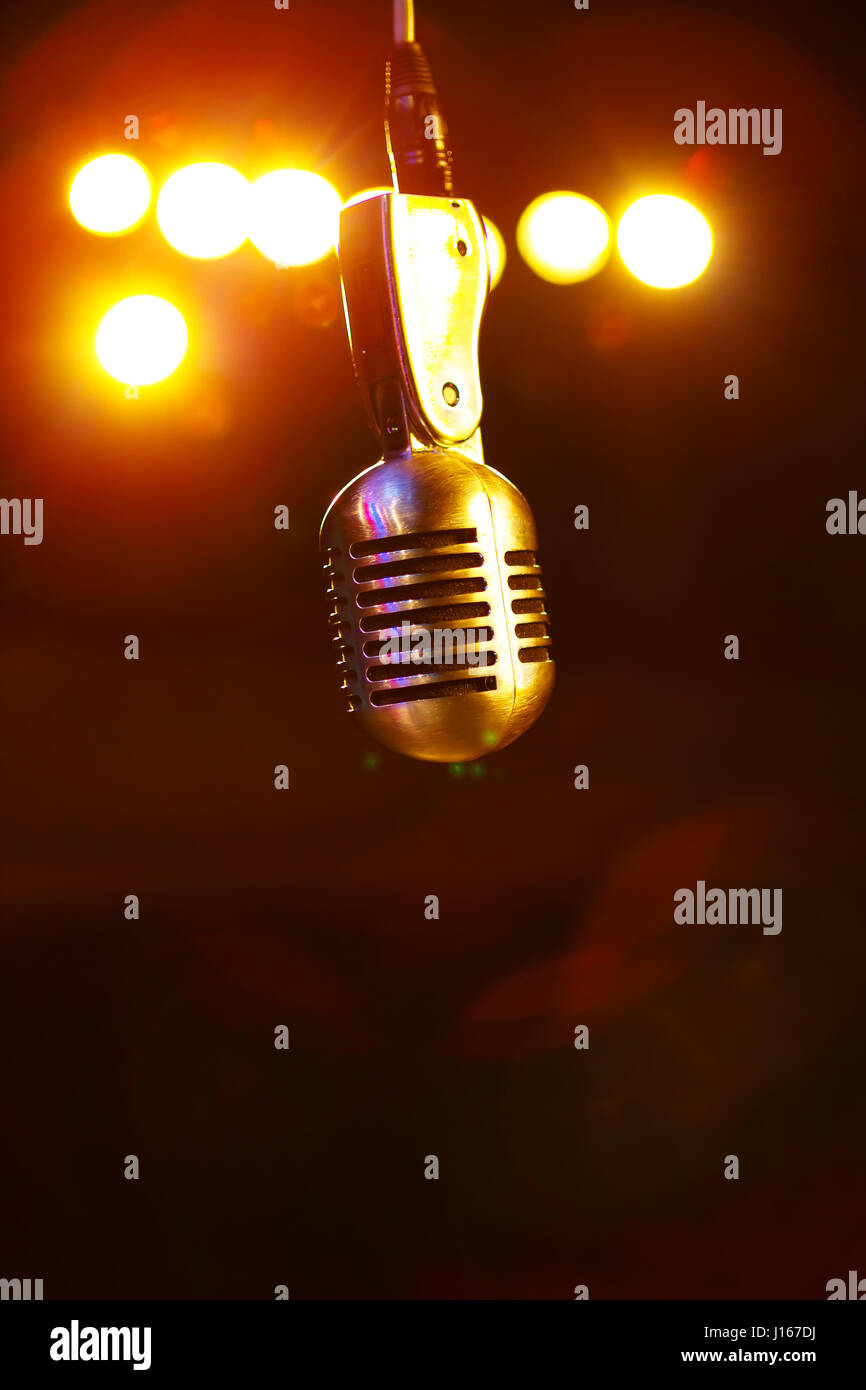 Microphone in the stage lights Stock Photo - Alamy