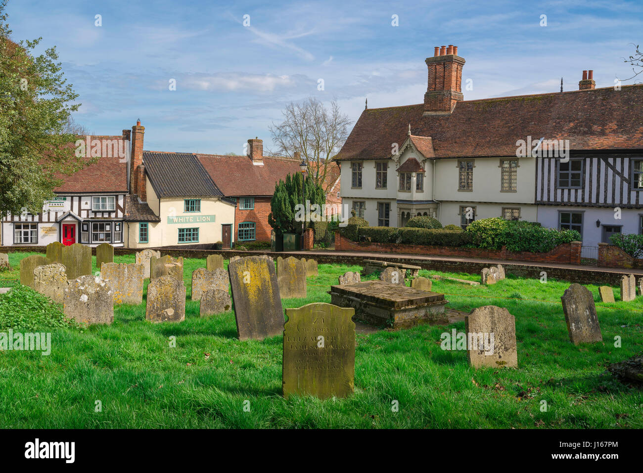 Halesworth Suffolk, view of the churchyard and medieval buildings along London Road in the centre of the rural Suffolk town of Halesworth, England UK Stock Photo
