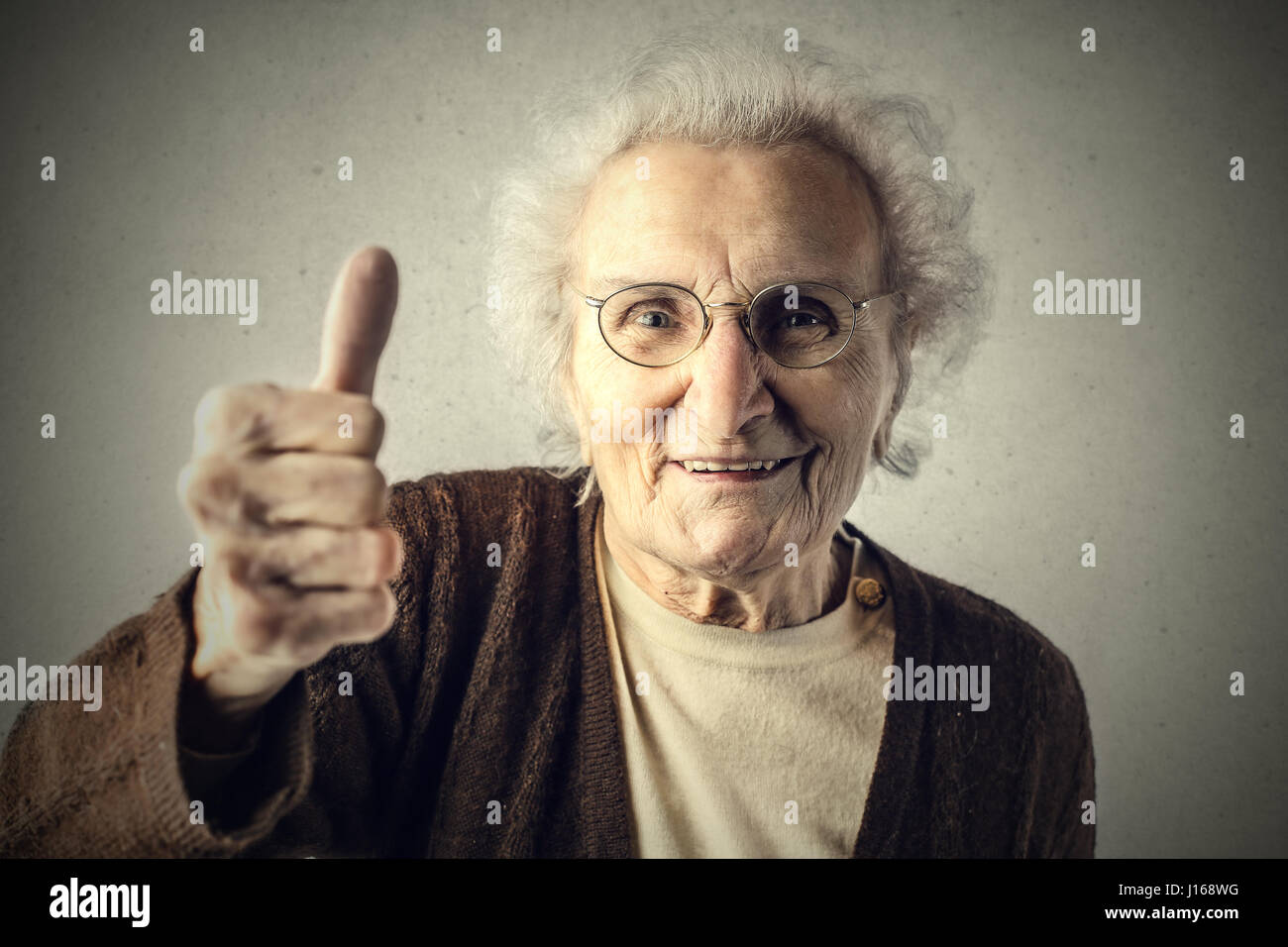 Old lady with glasses showing like sign Stock Photo