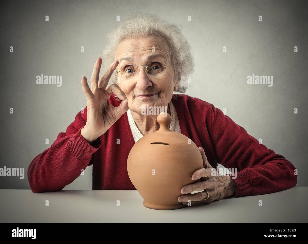 Old lady with piggy bank Stock Photo Alamy