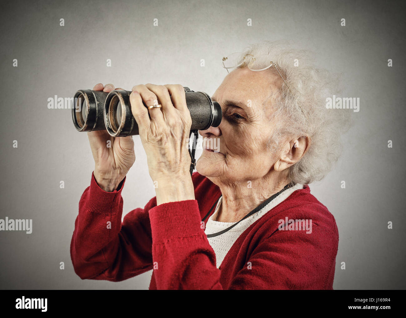 Old lady with telescope Stock Photo