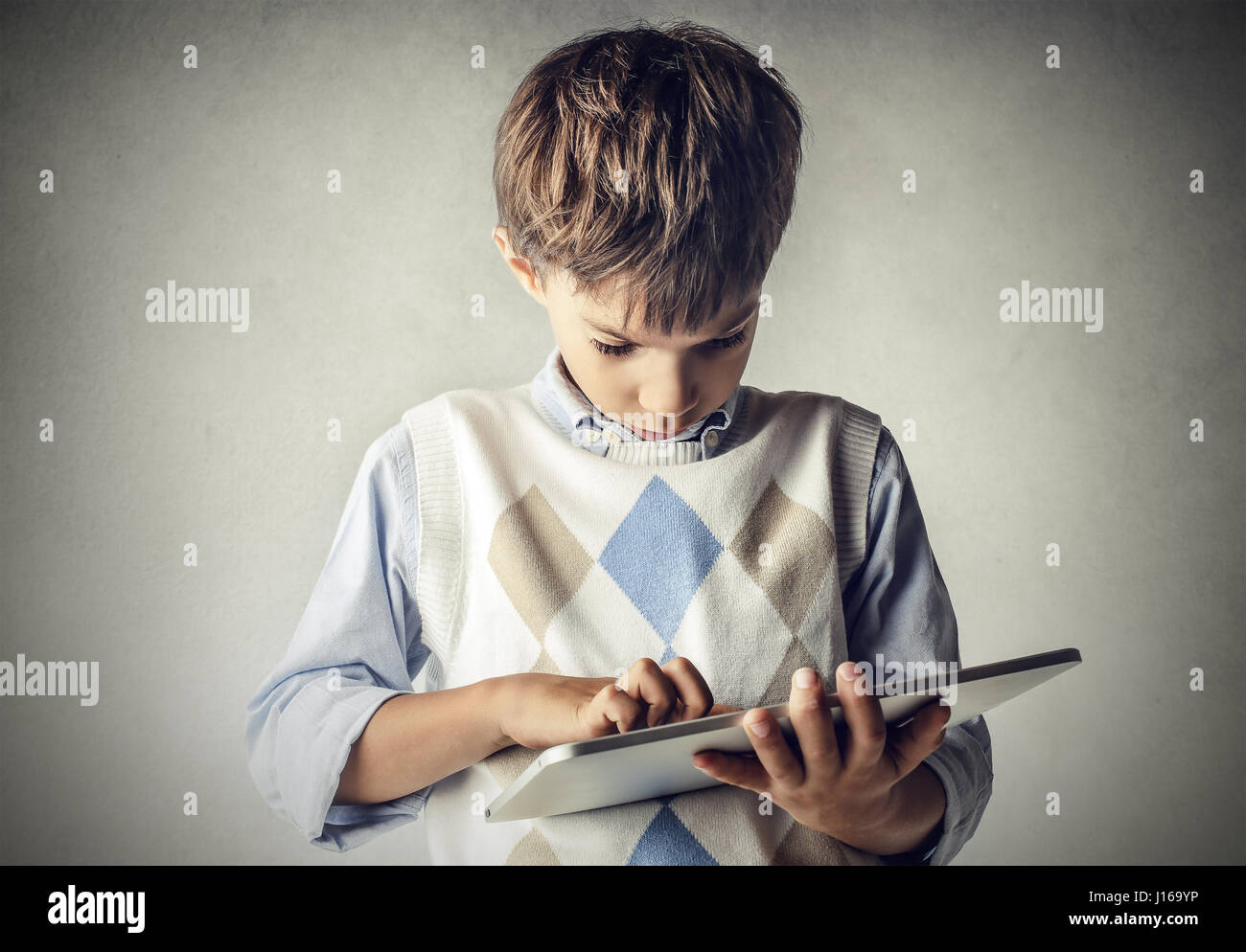 Little boy using laptop Stock Photo - Alamy