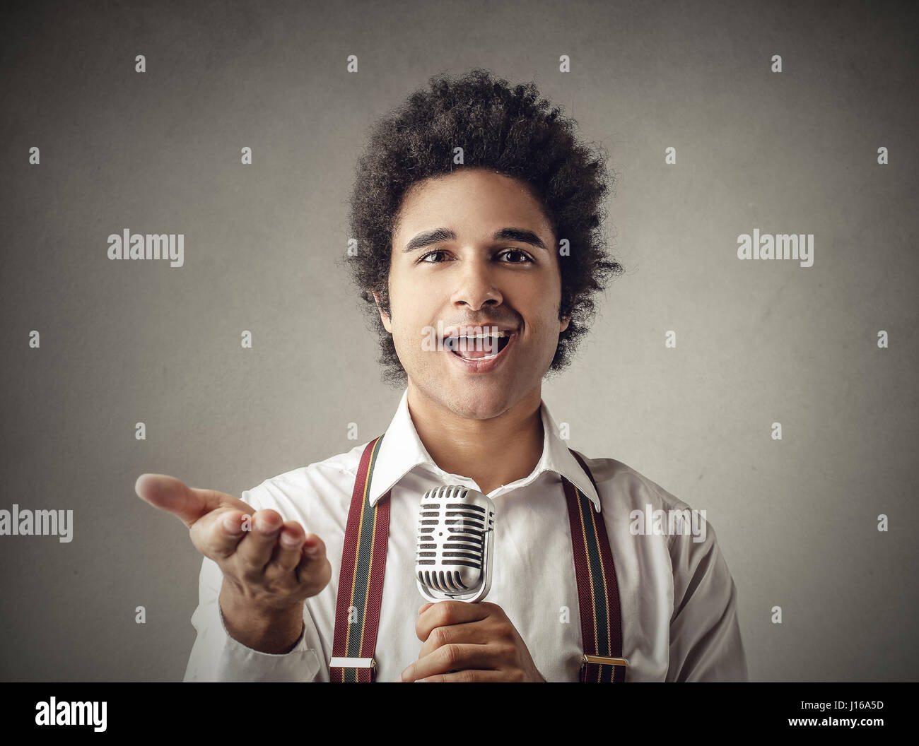 Young man talking with microphone Stock Photo