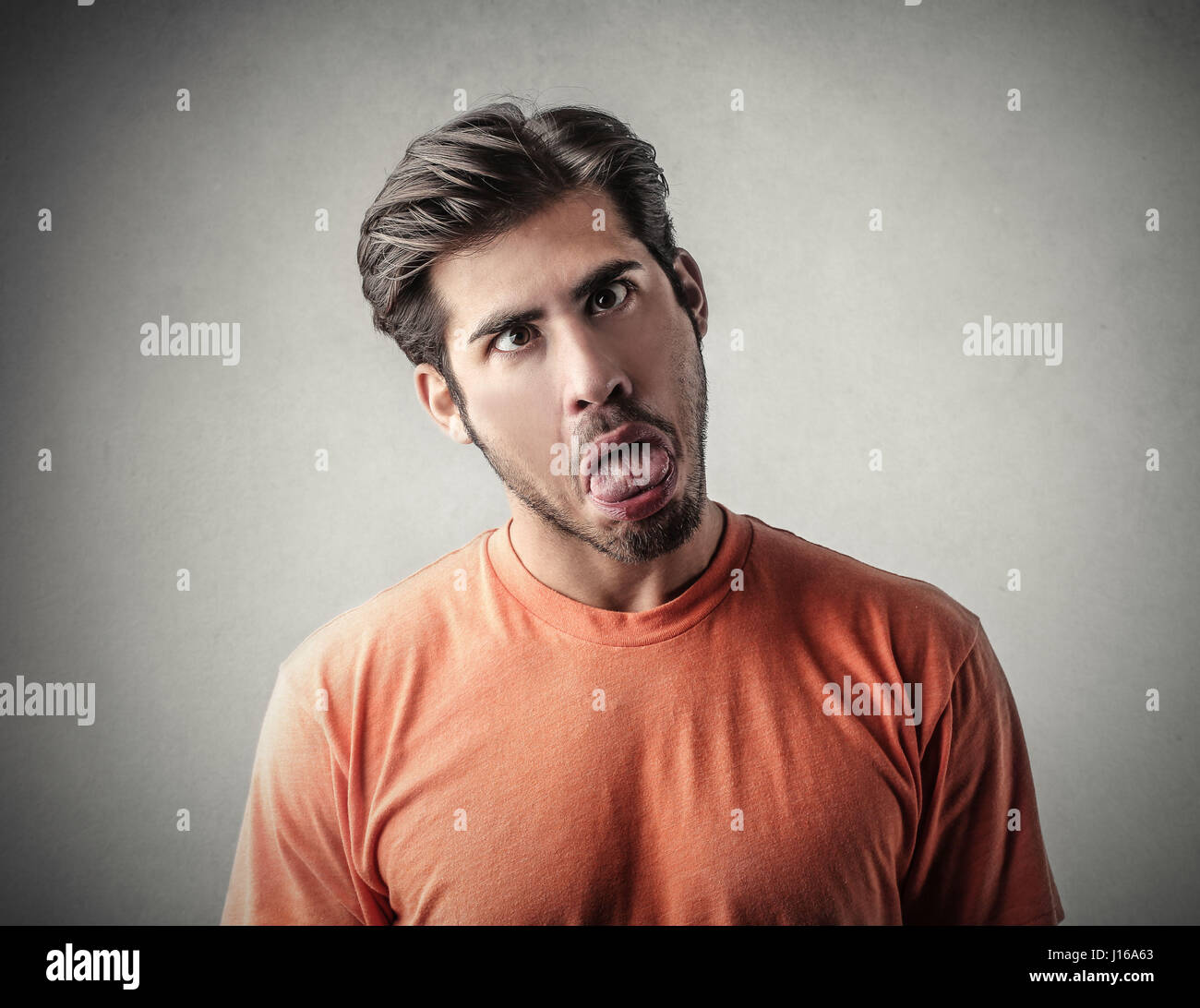 Young man making a grimace Stock Photo