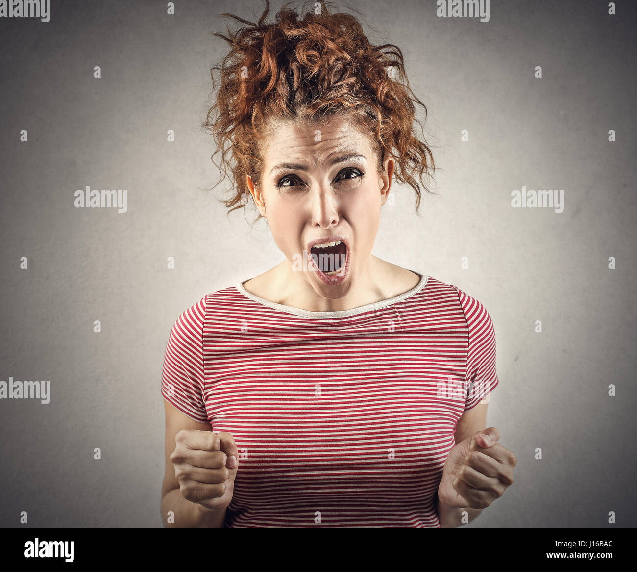 Curly woman being mad and sad Stock Photo