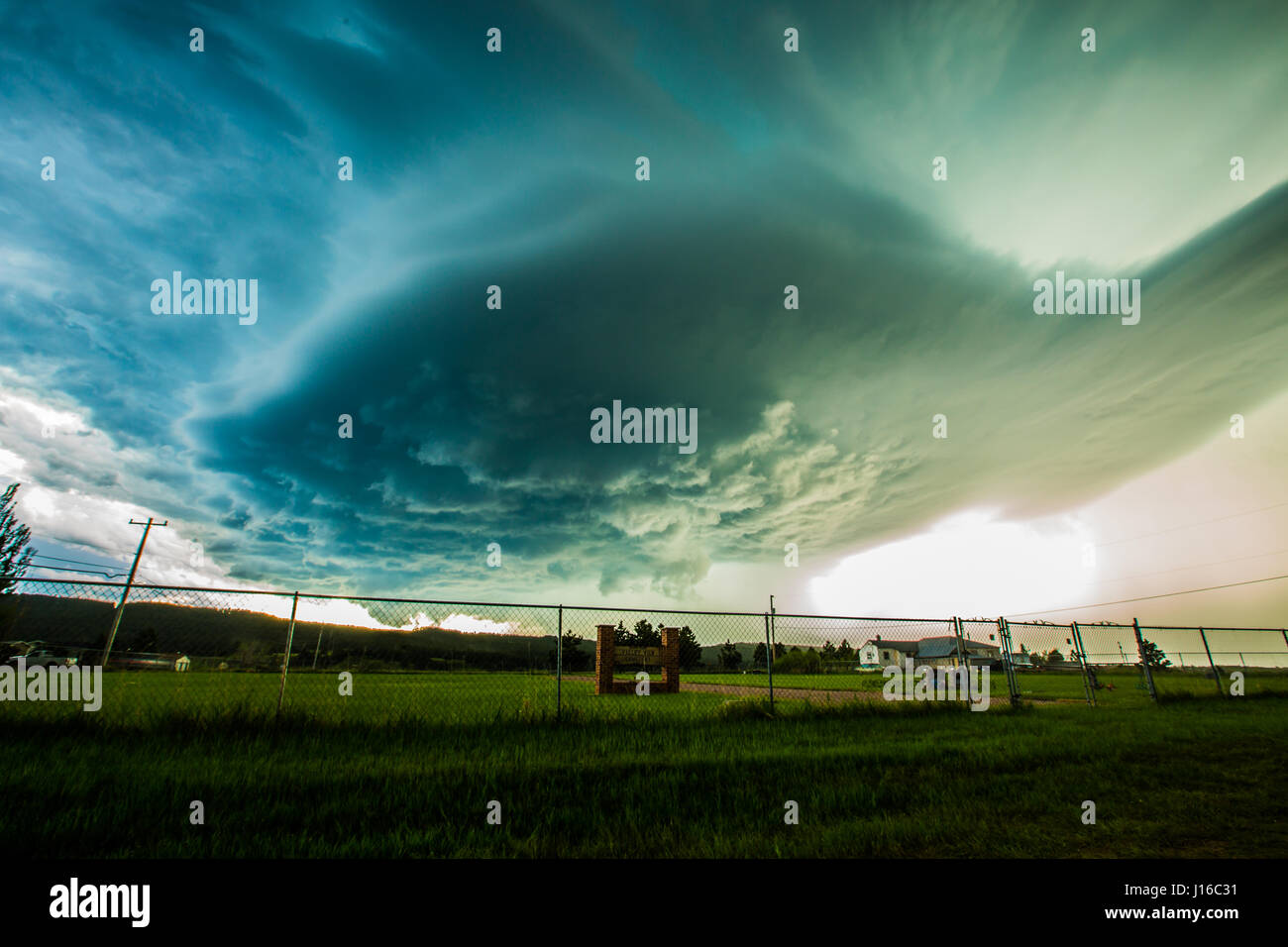 A JAW-DROPPING picture of what looks like a pink lightning bolt looping through the stormy sky and striking the Earth has been captured by an off-duty cameraman. The bolt appears to defy gravity itself by passing upwards before changing direction towards the ground. Other pictures taken by the amateur stormchaser shows in-car pictures of the gathering super-cell storm as it is pursued across the countryside, which can be seen being punished by high-winds. Australian film and TV cameraman Rick Smart (35) from Melbourne described the moment took the incredible shot while resting in a car park in Stock Photo