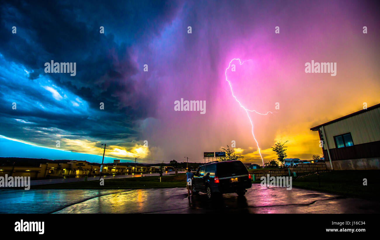 A JAW-DROPPING picture of what looks like a pink lightning bolt looping through the stormy sky and striking the Earth has been captured by an off-duty cameraman. The bolt appears to defy gravity itself by passing upwards before changing direction towards the ground. Other pictures taken by the amateur stormchaser shows in-car pictures of the gathering super-cell storm as it is pursued across the countryside, which can be seen being punished by high-winds. Australian film and TV cameraman Rick Smart (35) from Melbourne described the moment took the incredible shot while resting in a car park in Stock Photo