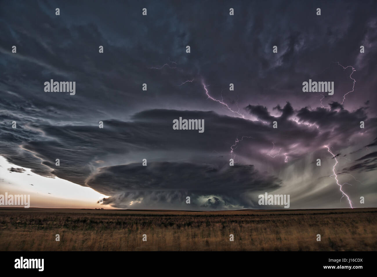 NABRASKA, USA: A TEACHER has braved death in an obsessive bid to document the birth and death of nature’s dramatic supercell storms. With the atmosphere crackling with tension, pictures show how this storm came alive with deadly explosions of lightning before this brave amateur stormchaser was able to make his escape and capture the calm blue sky and sunrays emerging from behind the once-angry clouds. The pictures were taken in the great plains of America’s Midwest by high-school chemistry teacher Mark Rosengarten (48) who has dedicated a decade of his life to chasing and documenting dramatic  Stock Photo