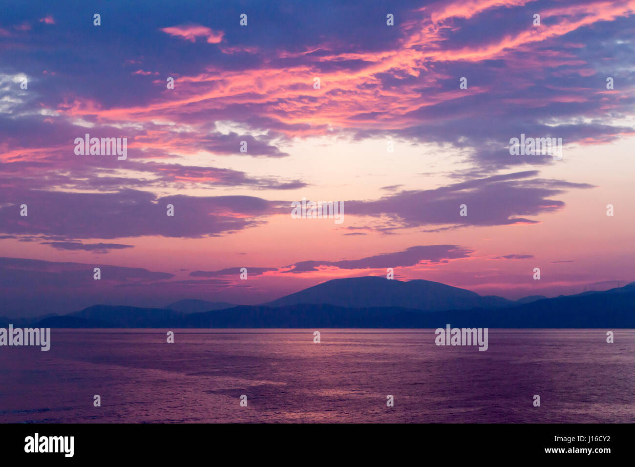 Incredible sunset among the islands in the sea Stock Photo
