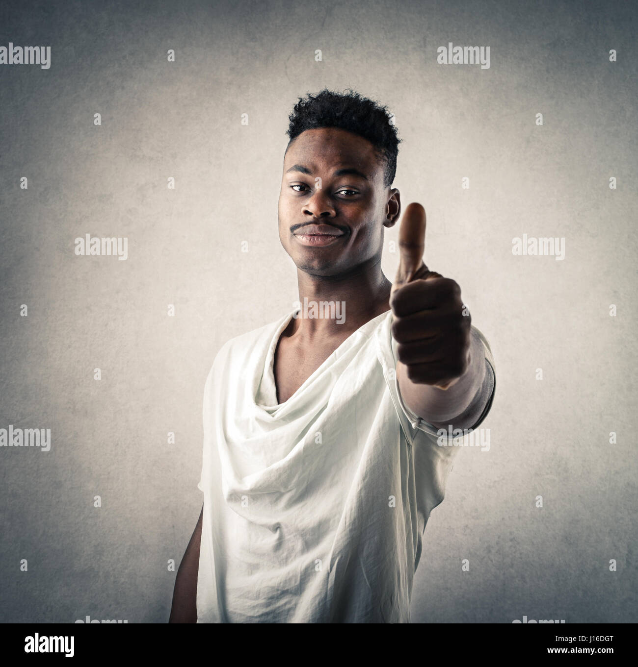 Black man showing like sign Stock Photo