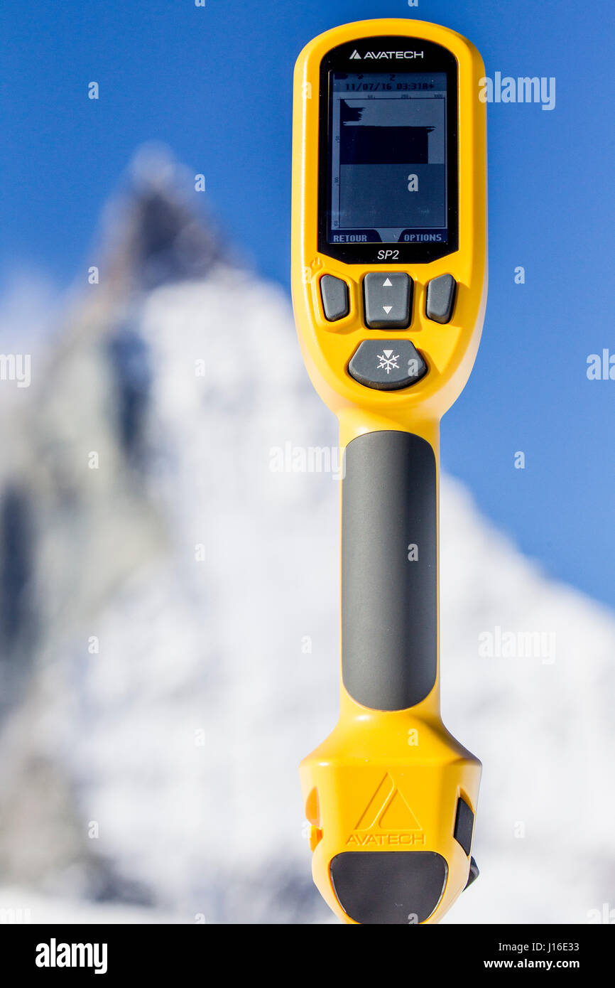 Snow profile measuring device with mountain peak in background Stock Photo