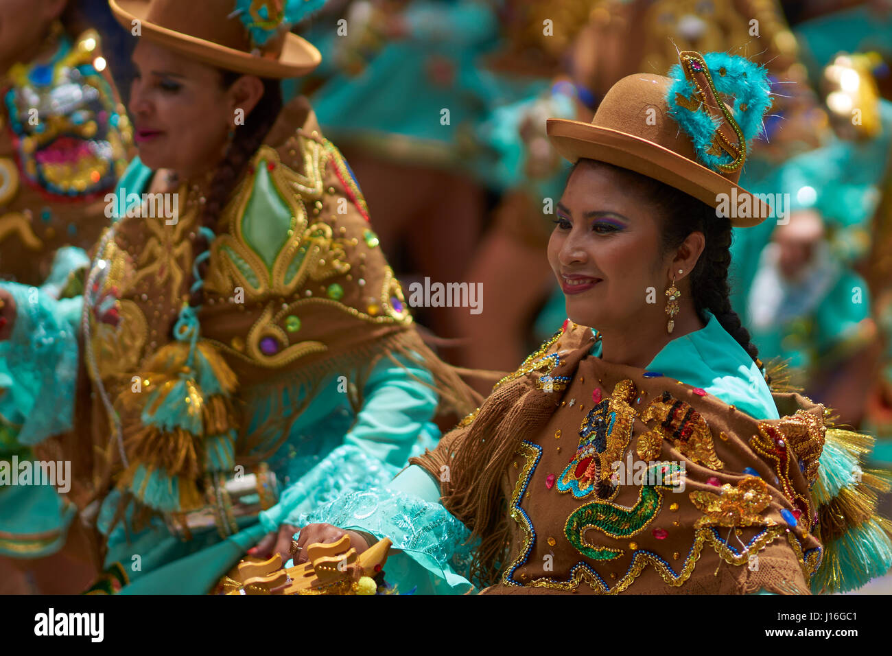 Morenada dancers in ornate costumes parade through the mining city of ...