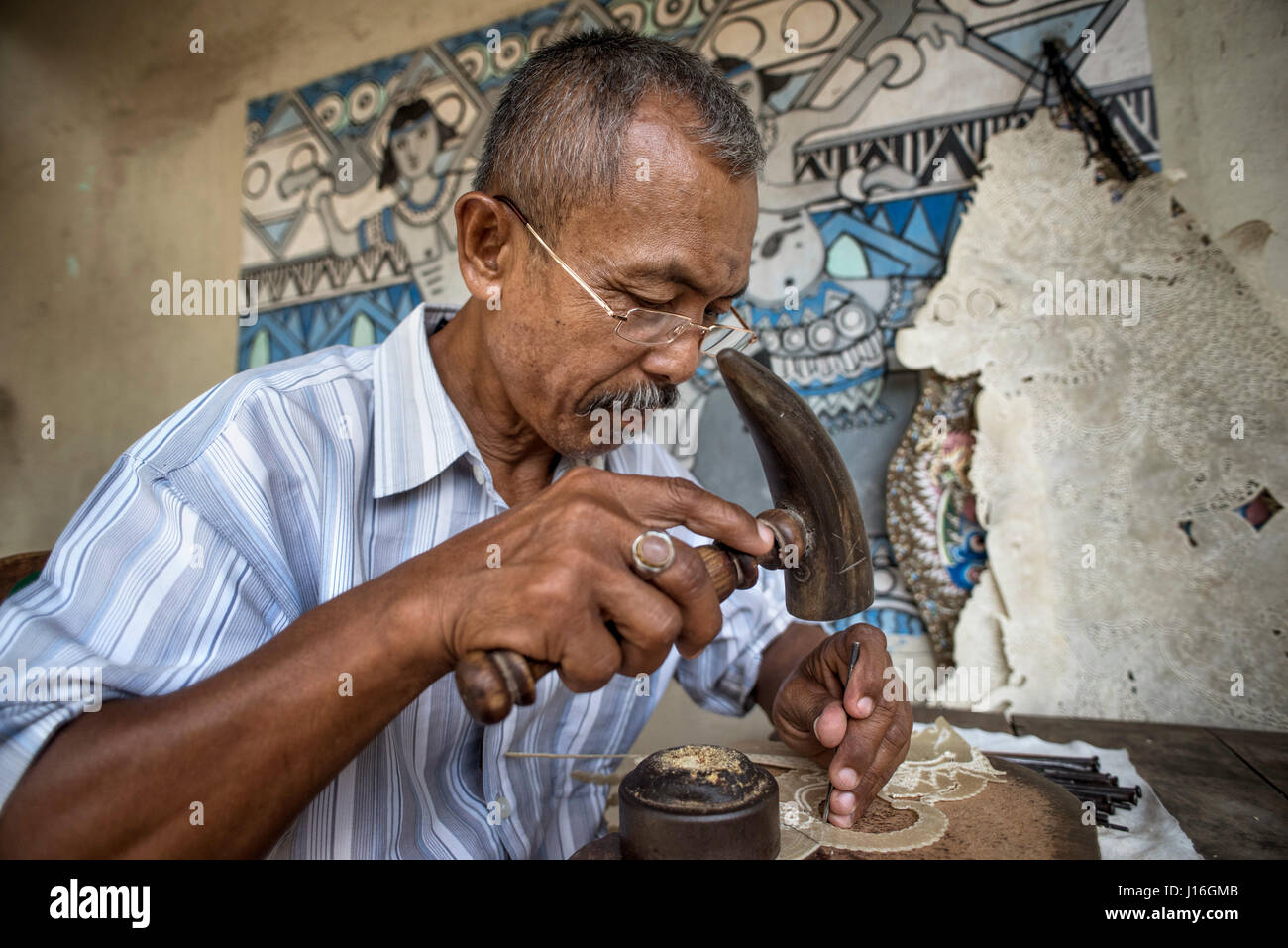 A Local Craftsman Making Leather Puppets In Yogyakarta, Java, Indonesia