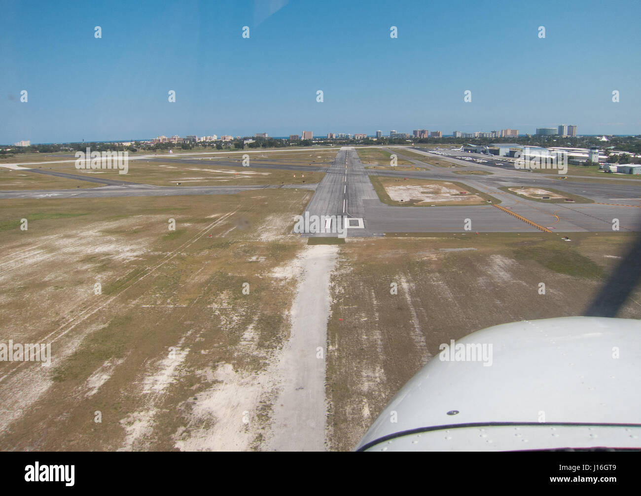 Pilot's eye view of final approach to a small general aviation airport in a small training aircraft, Florida Stock Photo