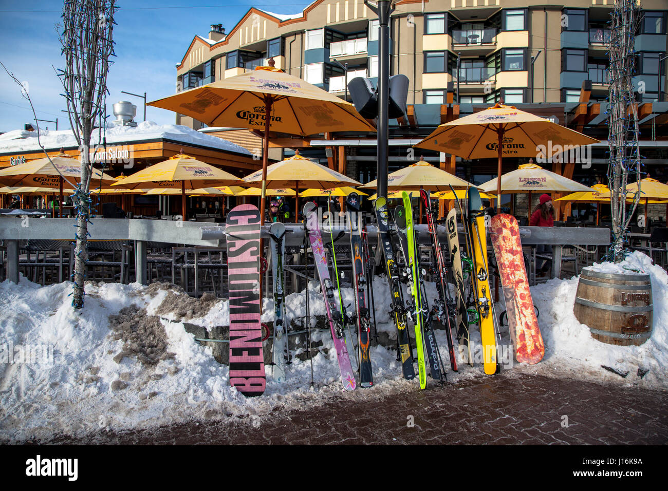 Skis, Snowboards, and Poles on a rack, Whistler, Canada Stock Photo