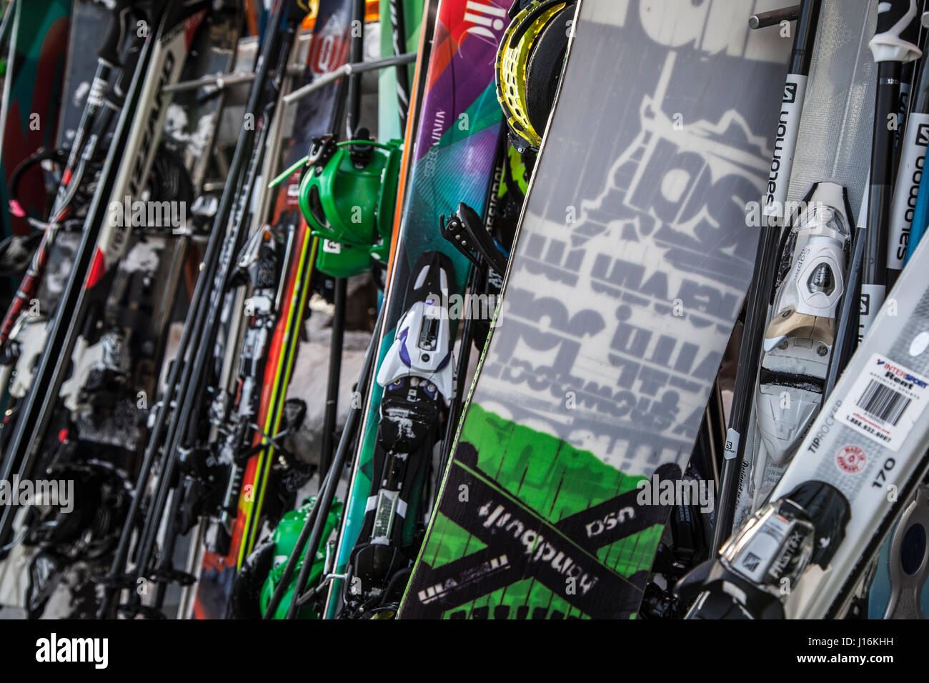 Skis, Snowboards, and Poles on a rack, Whistler, Canada Stock Photo
