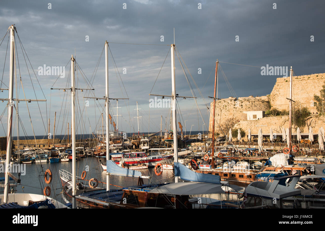 Harbour with yachts and boats at sunset at Kyrenia city harbor in Cyprus Stock Photo