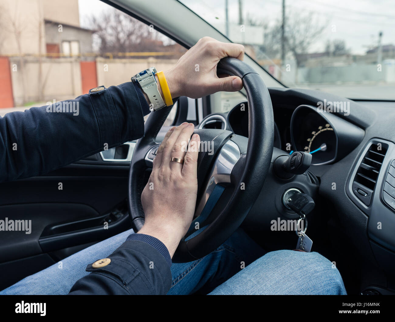 Nervous man driver pushing car horn Stock Photo