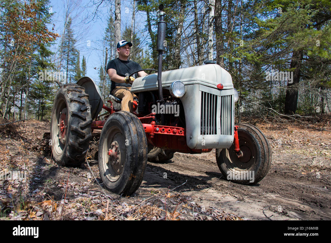 Man driving tractor hires stock photography and images Alamy