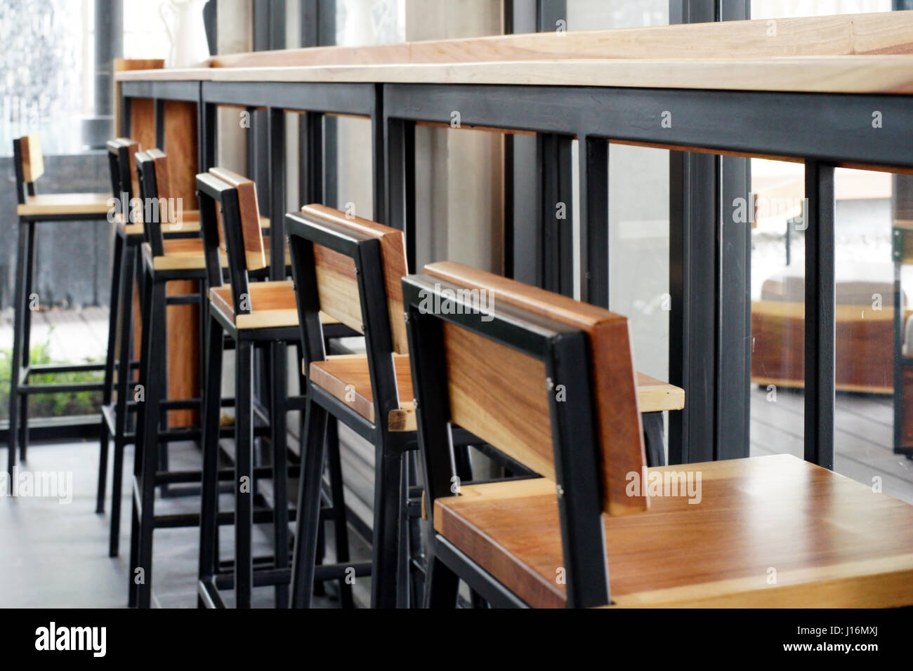 stool in front of counter bar at coffee shop Stock Photo