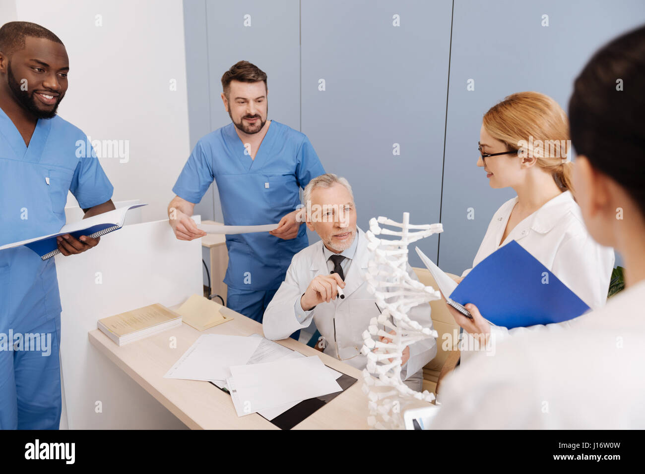 Aging mentor conducting exam in the medical university Stock Photo