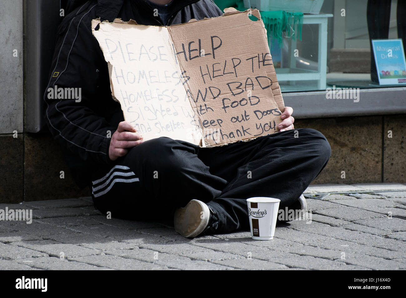 Homeless Person With A Cardboard Sign Stock Photo Alamy